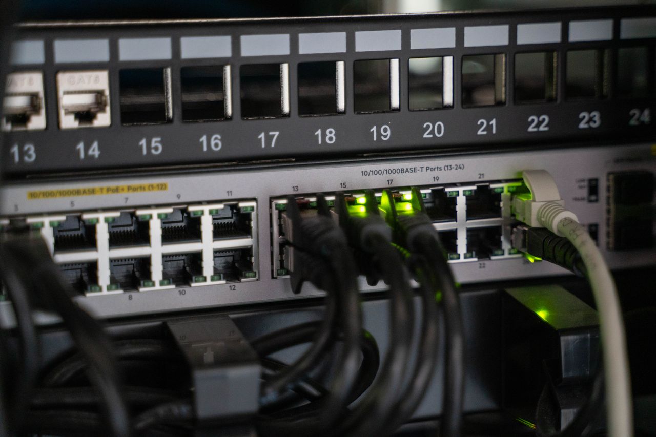 Home Networking equipment with connected cables, showcasing modern technology infrastructure.